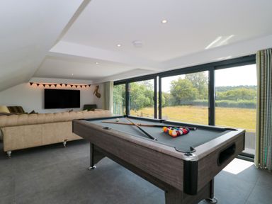 A game room with a pool table at Number 7 Bishop Sutton
