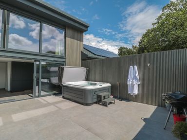 An outdoor space with a hot tub and grill at Number 7 in Bishop Sutton