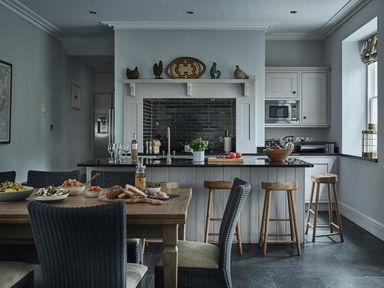 A kitchen with a dining table and chairs at Tan Llan in Llanelltyd near Dolgellau