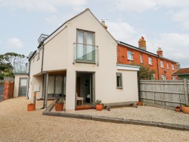 An exterior view of a house with landscaping at Coastguard Lookout in Wyke Regis