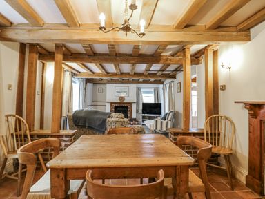 A living room with a table and chairs at White Gates in Banham