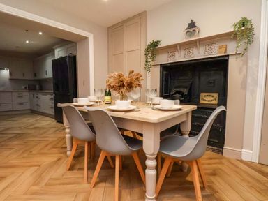 A dining room with a table and chairs at 59 Moorland Road in Scarborough