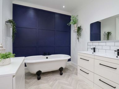 A bathroom with a bathtub and sink at 59 Moorland Road in Scarborough