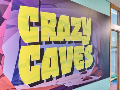 A wall sign displaying 'Crazy Caves' at Wavecrest - Hayling Island