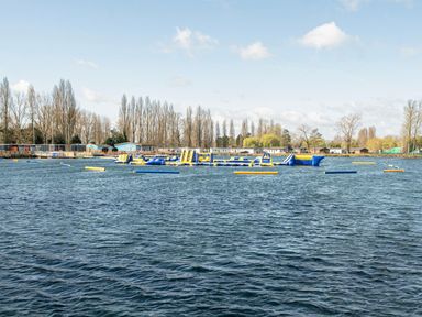 An outdoor photo of inflatable structures on water at Kingfisher Caravan - Billing Aquadrome