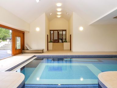 An indoor swimming pool area at Heathcliffe House in Castleton near Cardiff