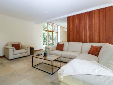 A living room with a sofa and coffee table at Heathcliffe House, Castleton near Cardiff