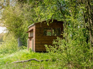 A wooden shed in a natural setting at Peony Eardisland
