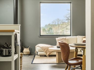 A living room with a window and sofa at Grove Cottage in Kington
