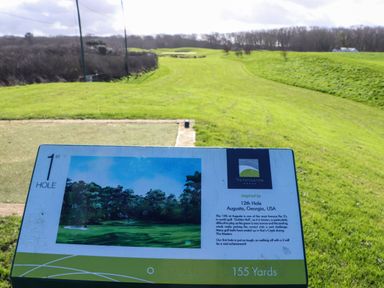 View of the first hole on a golf course with a sign describing the hole inspired by the 12th hole at Augusta in Georgia USA at Hepworth in Portreath