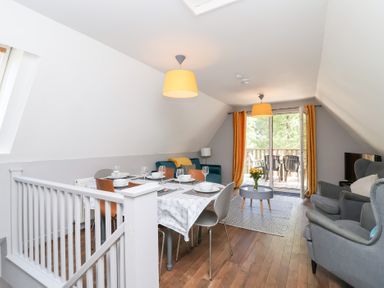 A dining room with a table and chairs at Valley Lodge 37 St Ann's Chapel, Cornwall