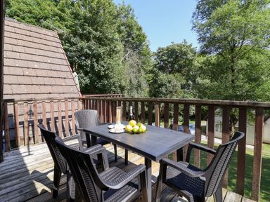 A patio with a table and chairs at Valley Lodge 37 St Ann's Chapel, Cornwall