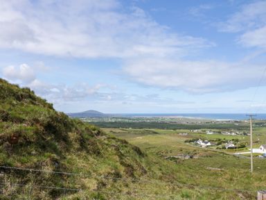 A scenic view of the ocean and mountains at Shane's Cottage in Falcarragh, County Donegal
