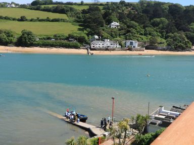 A beach scene with boats and people near the water at 43 The Salcombe Salcombe