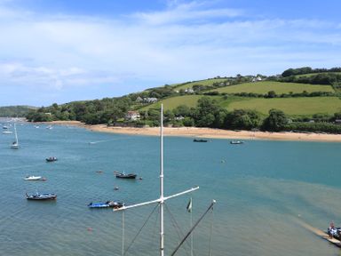 A beach view with boats on the water at 43 The Salcombe in Salcombe