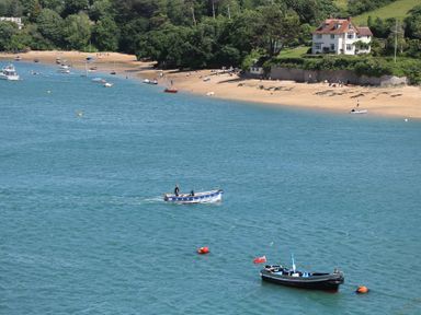 A view of boats on the water near a beach at 43 The Salcombe Salcombe