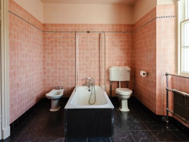 A bathroom with a bathtub, toilet, and bidet at Cheviot Manor in Akeld near Wooler