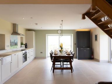 A kitchen with dining area at Golygfa Cwrt near Bontgoch and Penrhyncoch