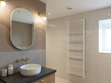 A bathroom with a wash basin and towel radiator at Golygfa Cwrt near Bontgoch and Penrhyncoch