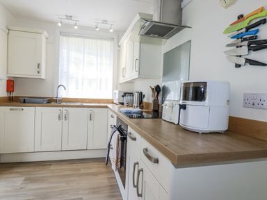 A kitchen with a sink and appliances at Sea Ledge in Tintagel