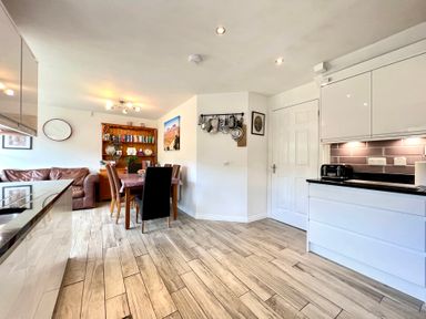 A kitchen with a table and chairs at Harefield in Rothbury