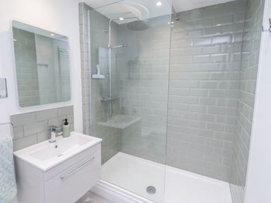 A bathroom with a shower and sink at 3 Lisburn Street Alnwick