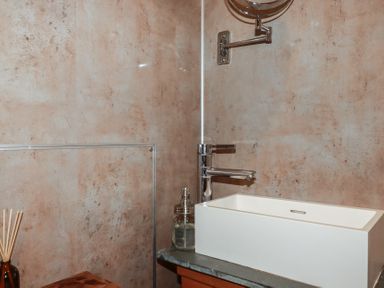 A bathroom with a sink and faucet at Stribleys Barn Cusgarne near St Day