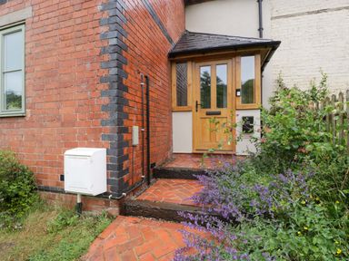 An entrance with a pathway and plants at 2 Loxter Villas Wellington Heath near Ledbury