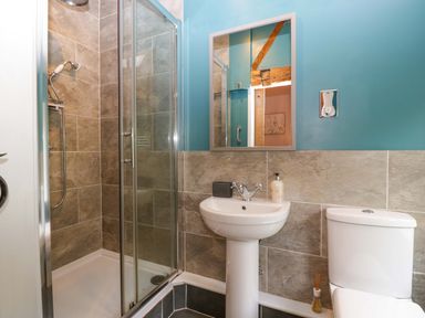A bathroom with a shower and sink at 2 Loxter Villas Wellington Heath near Ledbury