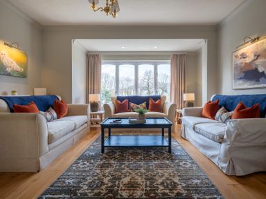 A living room with sofas and a coffee table at Marina View in Bowness-On-Windermere