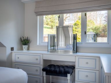 A bedroom with a dressing table and mirror at Marina View in Bowness-On-Windermere