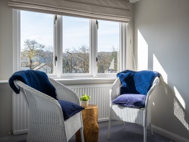A snug with two chairs and a table at Marina View Bowness-On-Windermere