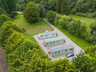 An outdoor area with cabins and a pathway at Lodge 2 Silverdale