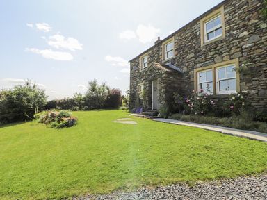 A stone house with garden and pathway at High Wood Foot, Bampton, Cumbria