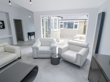 A living room with armchairs and a coffee table at Chillon South Littleton near Honeybourne