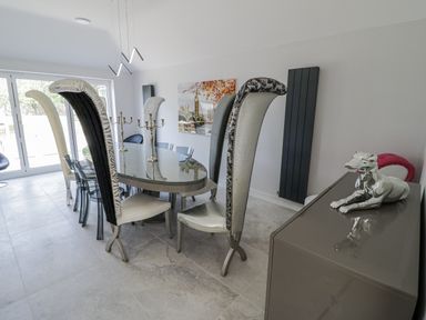 A dining room with a large table and unique chairs at Chillon South Littleton near Honeybourne
