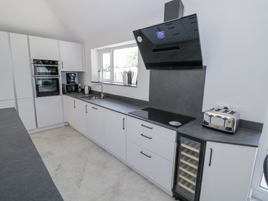 A kitchen with a sink and appliances at Chillon South Littleton near Honeybourne