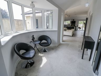 A seating area with two chairs and a table at Chillon South Littleton near Honeybourne