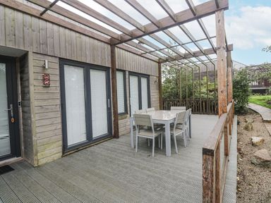 An outdoor area with a table and chairs at The Black Barnacle Portreath
