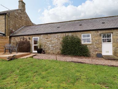 A cottage with a deck and garden at Petty Knowes Cottage Rochester near Otterburn