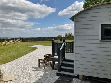 An outdoor area featuring a deck and chair at Little Acre in Oxenhope