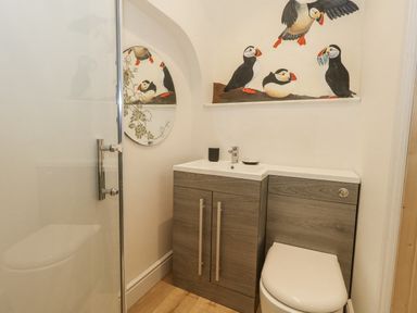 A bathroom with a sink and toilet at Sea Pink Studio in Swanage