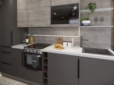 A kitchen with a stove oven microwave sink wine bottles and bread on a cutting board at Hodge Luxury Pod in Keswick