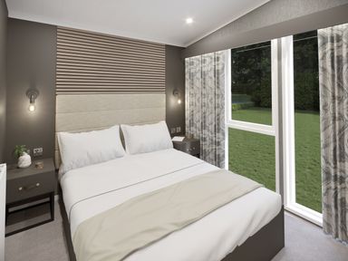 A bedroom with a double bed two bedside tables and a large window overlooking a garden at Hodge Luxury Pod in Keswick