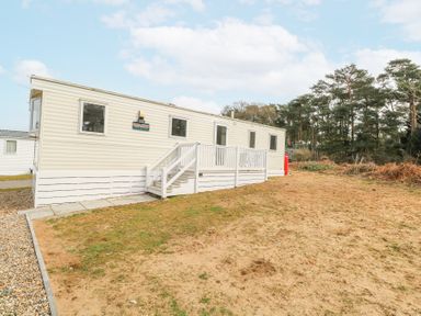A mobile home with steps and railing on a plot of land near trees at 31A Foxburrow Hang in Fritton near Belton Norfolk