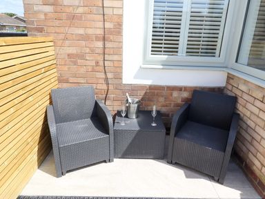 An outdoor space with chairs and a table at North Sands in Beadnell