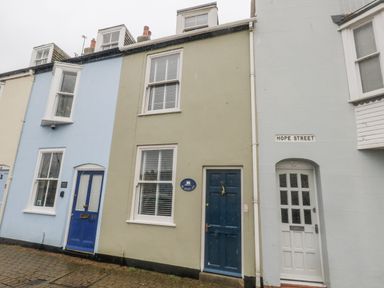 A building with blue and green doors on Hope Street at Harbourside Weymouth