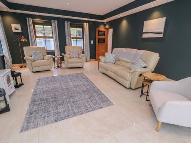 A living room with two recliners and a sofa at Ard Na Mara, Drung near Quigley's Point, County Donegal