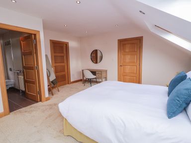 A bedroom with a bed and desk at Ard Na Mara Drung near Quigley's Point County Donegal