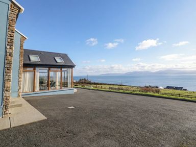 An outdoor view of a building by the sea at Ard Na Mara Drung near Quigley's Point, County Donegal